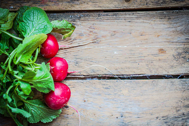 istock Radishes on rustic wooden background 469665829