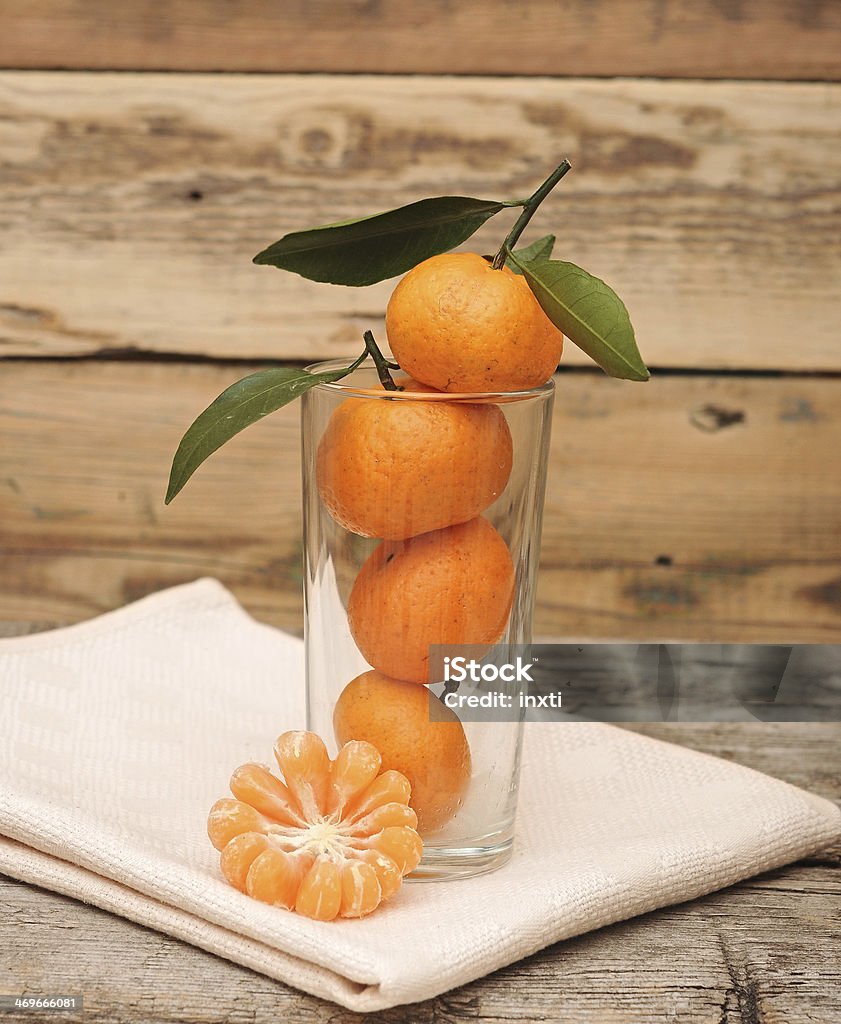 Tangerines en un vaso. - Foto de stock de Agricultura libre de derechos