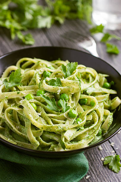 istock Tagliatelle pasta with spinach and green peas pesto 469666426