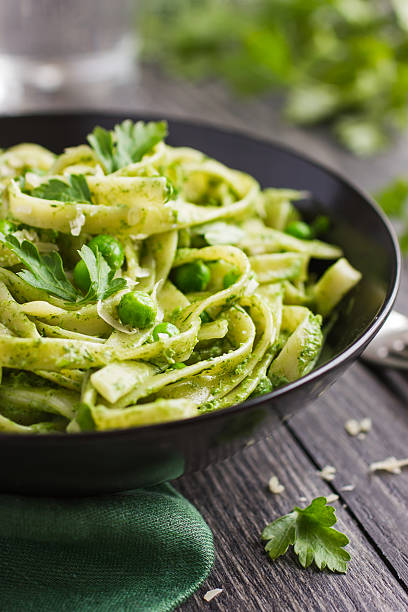istock Tagliatelle pasta with spinach and green peas pesto 469666432