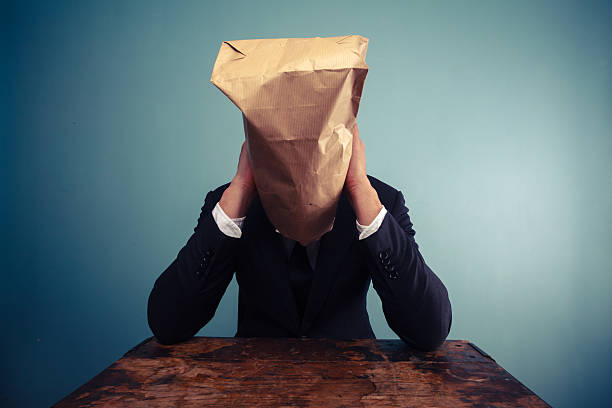 istock Sad businessman with bag over his head 469666537