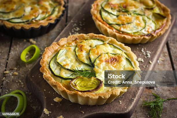 Tart With Zucchini Leek And Cheese On Rustic Background Stock Photo - Download Image Now