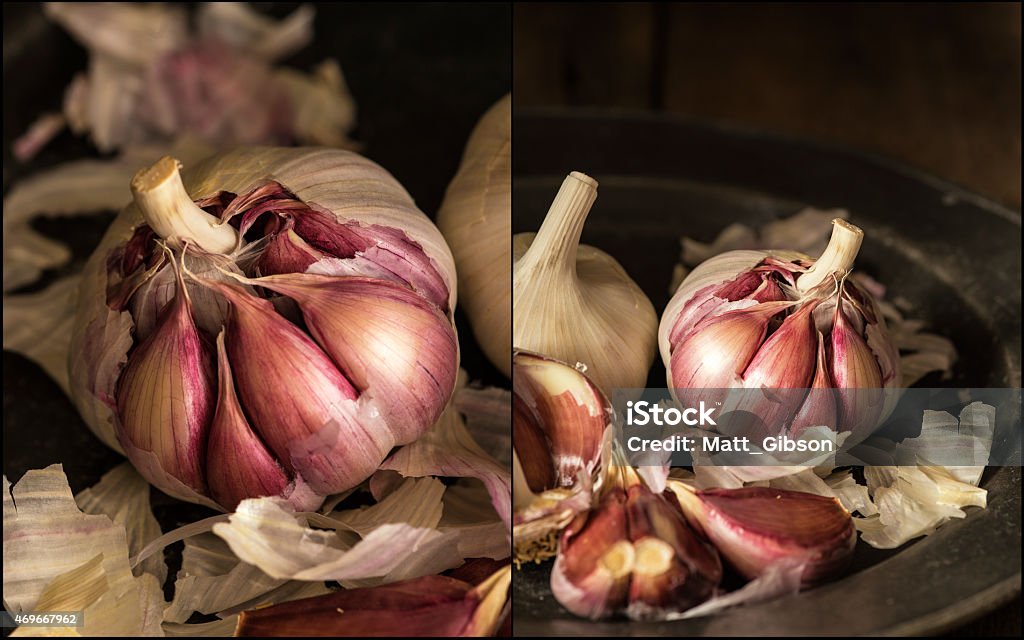 Compilation of Fresh raw garlic in natural lighting set up Compilation of Fresh raw garlic in moody natural lighting set up with vintage style 2015 Stock Photo