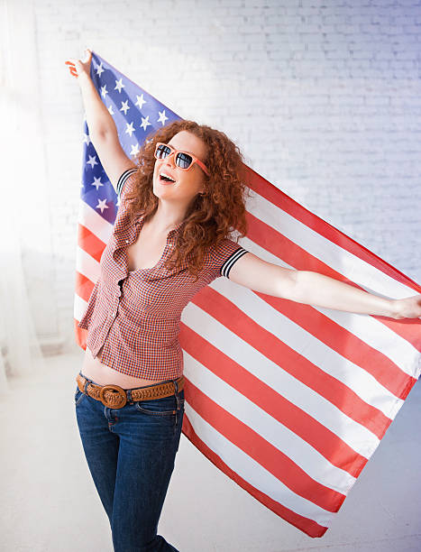istock Woman with American flag 469667965