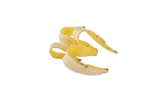 istock slippery banana skin on a white background 469668920