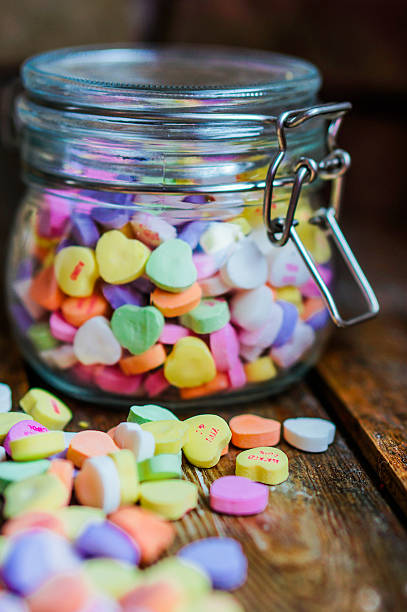 istock Heart candies on rustic wooden background 469669299