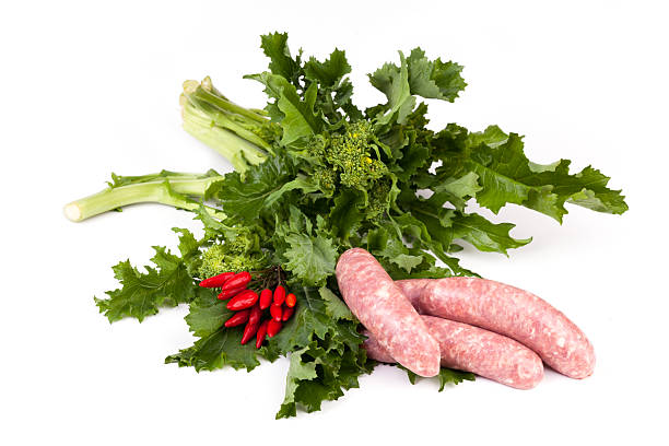 необработанные rapini и сосиска - broccoli raab стоковые фото и изображения