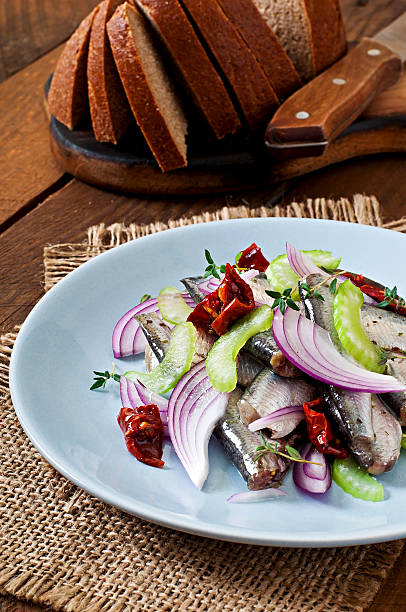 istock Herring salad with sun-dried tomatoes, celery and red onion 469671616