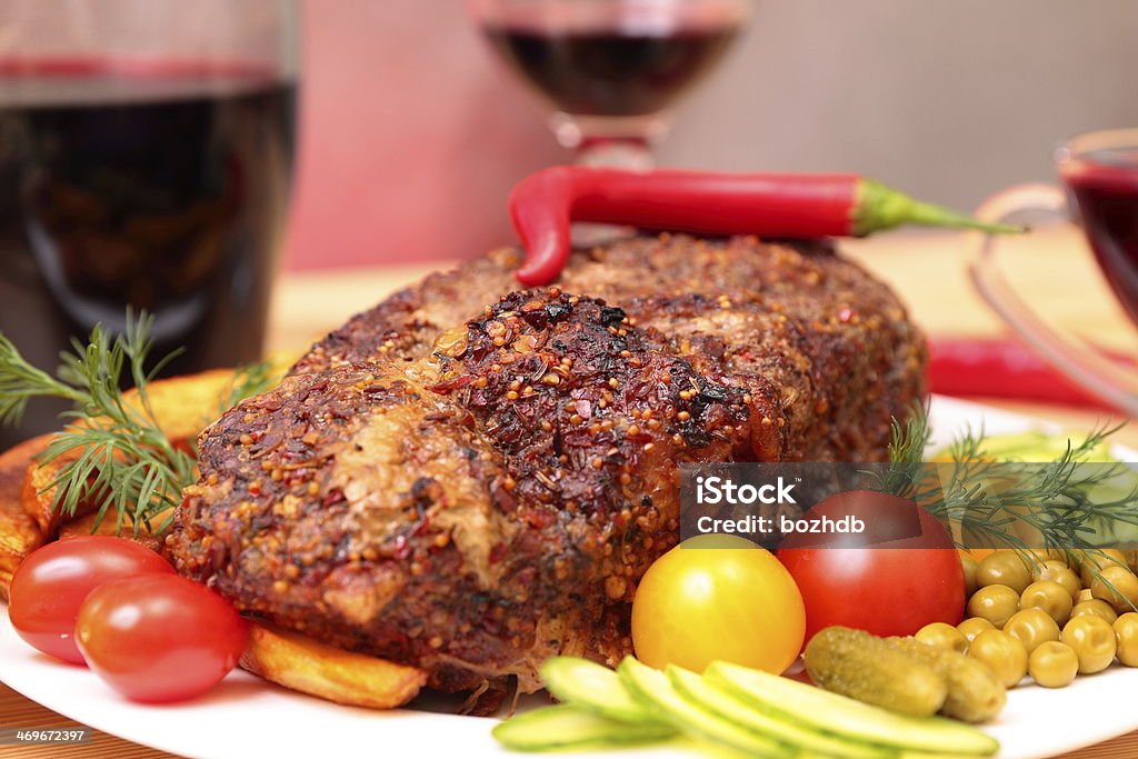 Appetizing roasted fillet of pork Appetizing roasted fillet of pork with spices and vegetables Affectionate Stock Photo