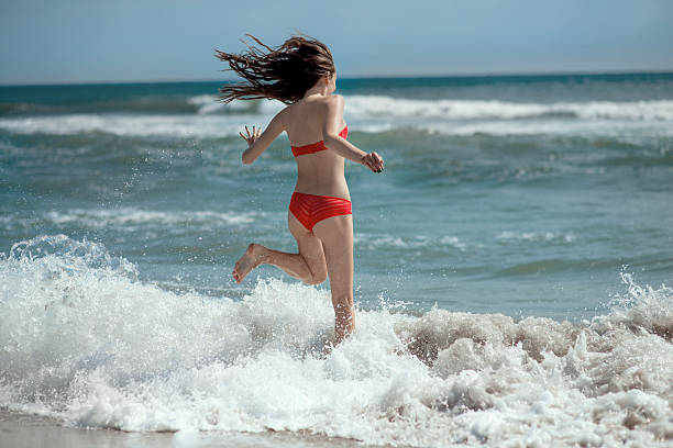 istock girl on the beach 469672957