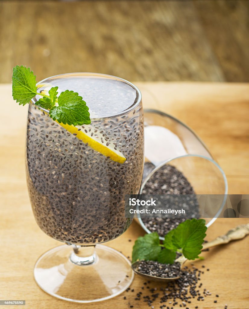Chia seeds drink with water Chia seeds drink with water in transparent glass with lime and lemon balm. selective Focus 2015 Stock Photo