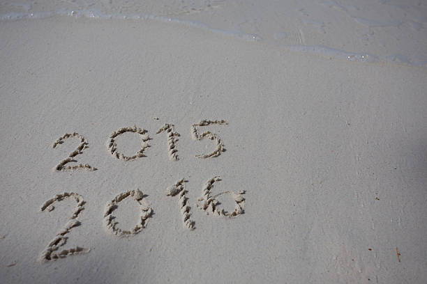 istock Numbers 2016 on beach - concept holiday background 469675760