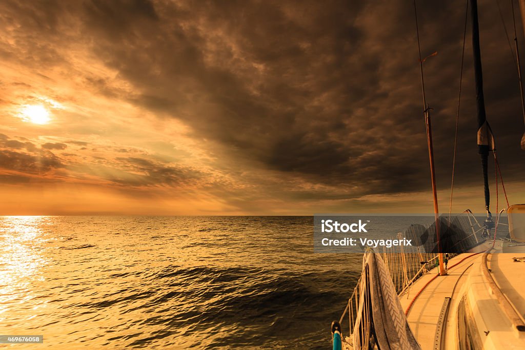 Yachting yacht sailboat in baltic sea at sunset sunrise. Yachting yacht sailboat sailing in baltic sea at sunset sunrise summer vacation. Tourism luxury lifestyle. Sailing Ship Stock Photo