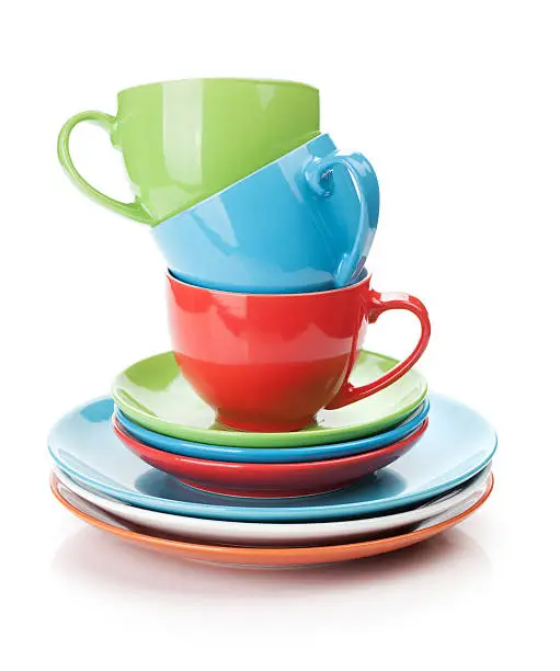 Photo of Multicolored dishes on a white background