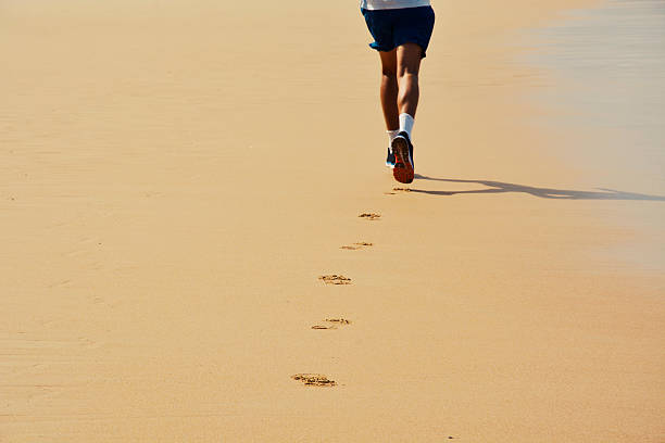 Man Running on the beach stock photo