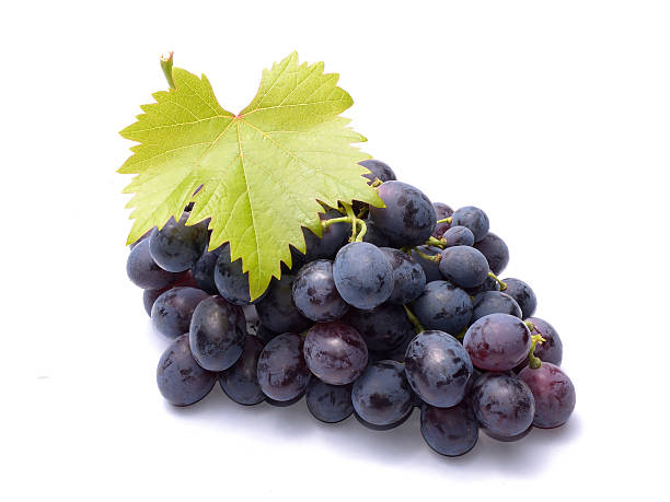istock Red grapes with leaves isolated on white background 469676732