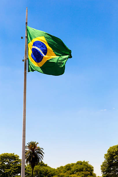 istock Brazilian waving flag on blue sky 469676892