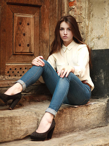 istock Young girl sitting outdoors sad 469677166