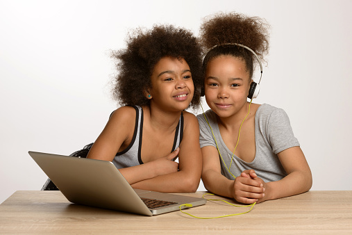 two african children listen to music
