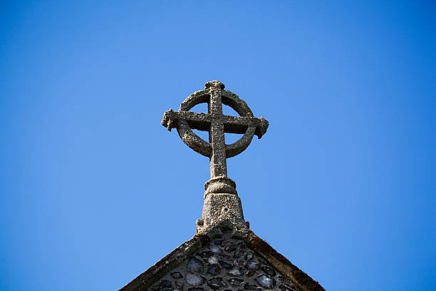 istock Celtic cross on old parish Church in Eastern England 469683122