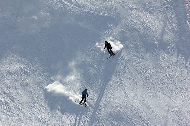 Playful artwork with two women skiing together on snowy mountain slope. Concept of shared winter adventure, female friendship outdoors, active lifestyle, recreational sports travel, joyful movement.