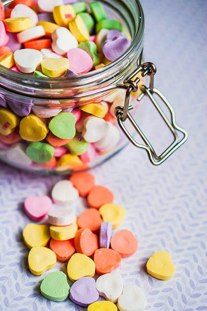 istock Closeup of heart candies with message 469683383