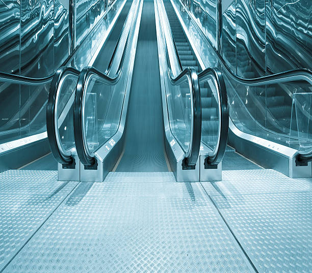 istock contemporary moving escalator stairs inside business blue hall 469684071
