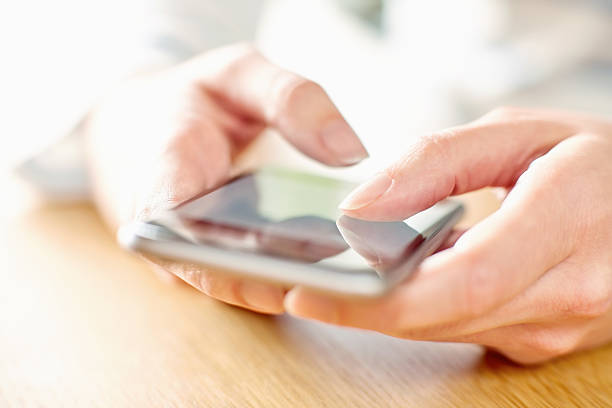 istock Cropped image of hands using smart phone 469685262