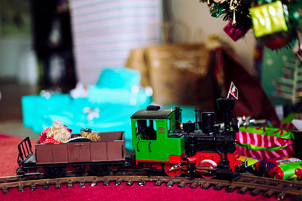 istock Model train with Xmas tree and gifts 469685354