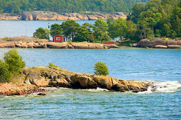Aland archipelago in  Baltic Sea with thousands of tiny rocky islands formed of red granite.