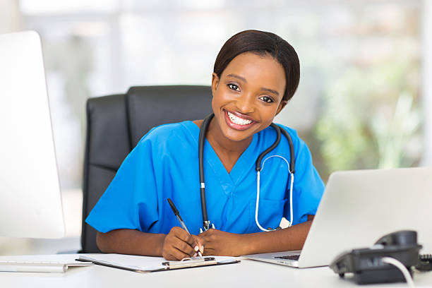 istock young african female nurse working in office 469689342