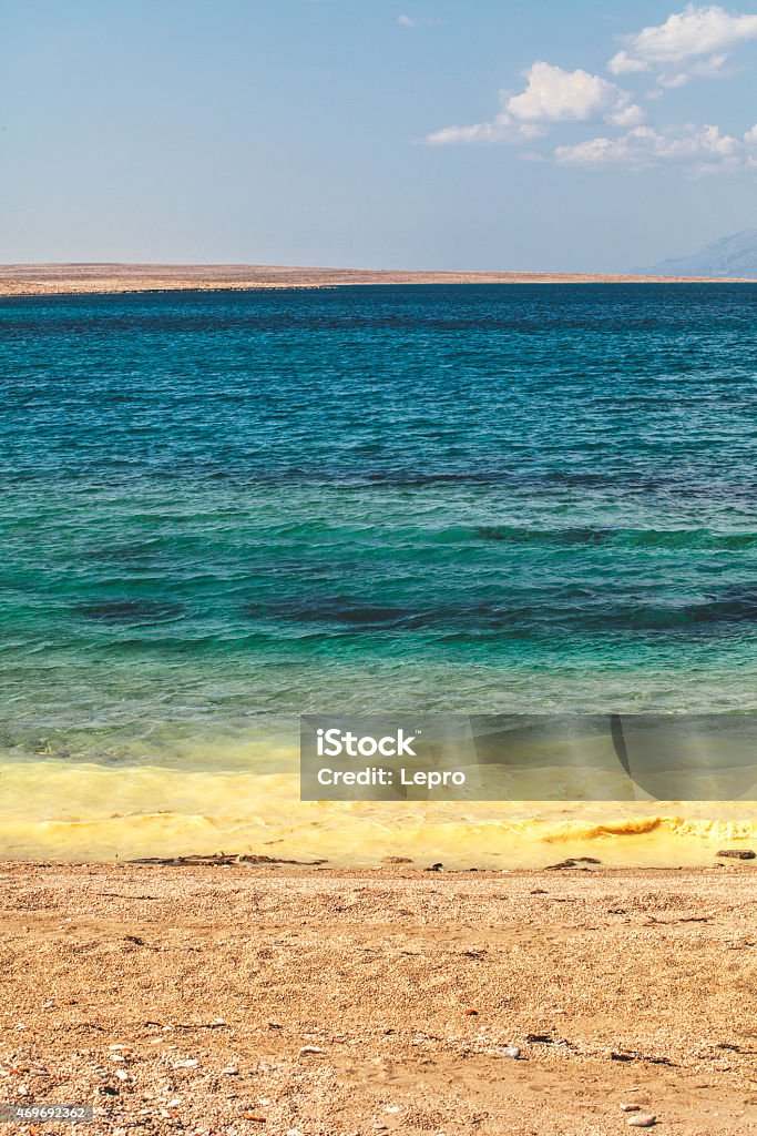 Layers of nature Layers of nature: sky, island, sea, beach. Beautiful layers of nature, horizontaly arranged in the vertically frame. Sea on the beach ejected silt and mud, adding in this wonderful landscape more color. 2015 Stock Photo