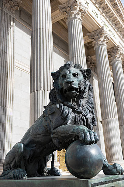 istock Lion statue outside the Spanish Congress in Madrid 469695673
