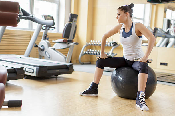 istock Young woman training in the gym 469695995