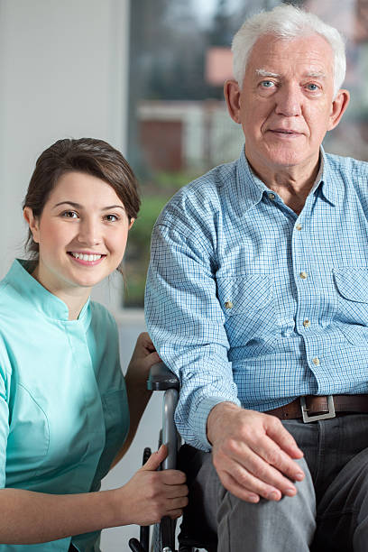 istock Disabled man and social welfare worker 469697136