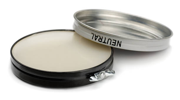 Neutral toned shoe polish isolated on white background