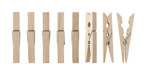Set of wooden clothes pins , clipping path , white background