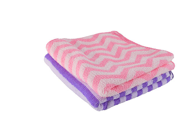 istock Purple and pink bath-towel stacking on white background 469700986