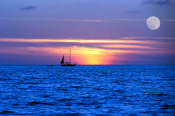 istock Sailboat Ocean Moon LightNight  Journey 469703084