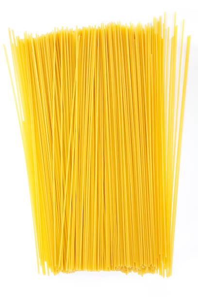 istock Uncooked Italian spaghetti on a white background 469707491