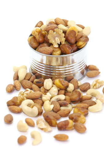 Mix of nuts close - up on white background