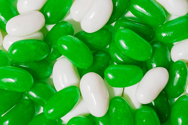 Green and white jelly beans stock photo