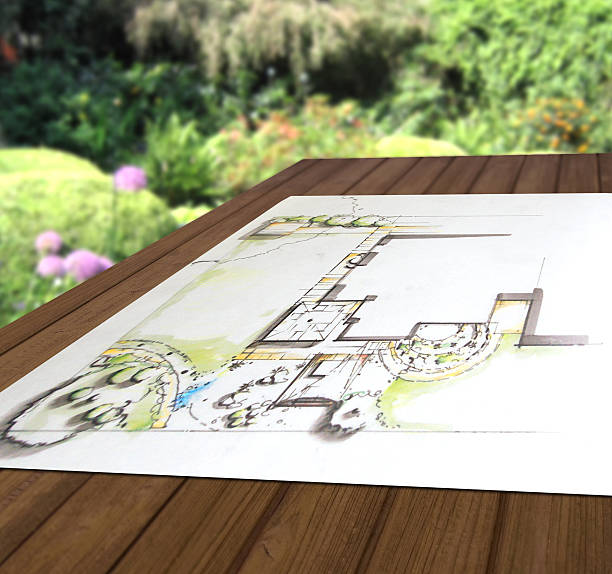 Garden planning - design drawing on wooden table Garden planning - design drawing on wooden table standort stock pictures, royalty-free photos & images