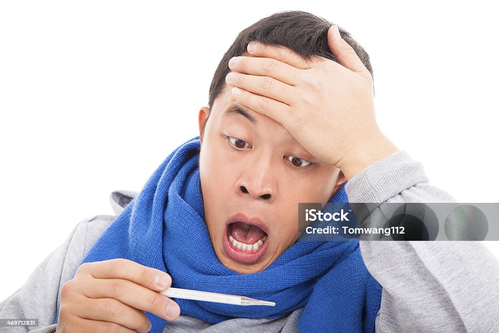young man with a fever temperature, surprising expression young man with a fever temperature, surprising expression on white Abundance Stock Photo