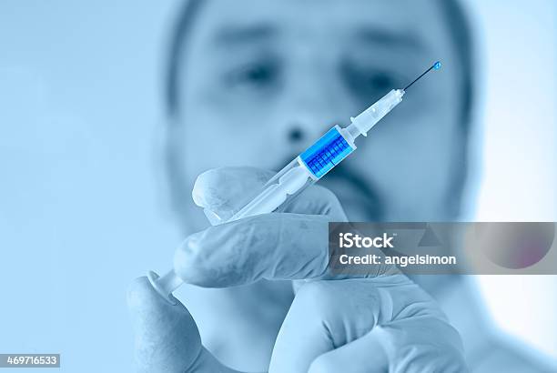 Doctor Holding A Syringe Stock Photo - Download Image Now - Accuracy, Adult, Adults Only