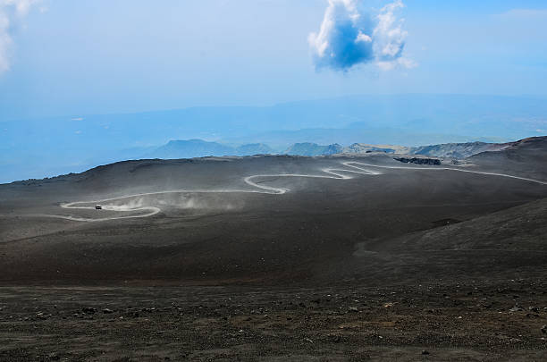 istock Dusty curvy road on Etna volcano, Sicily 469717629