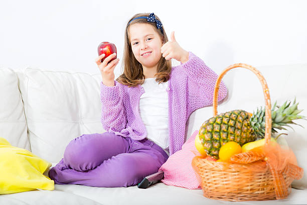 istock little girl with apple 469718875
