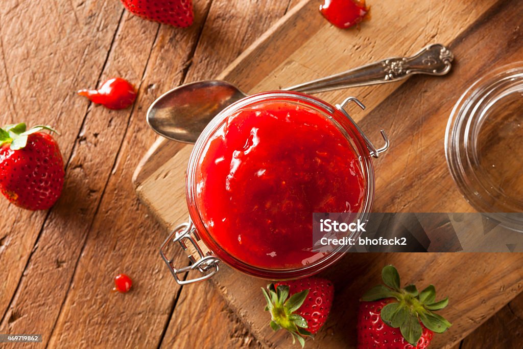 Homemade Organic Strawberry Jelly Homemade Organic Strawberry Jelly in a Jar Preserves Stock Photo