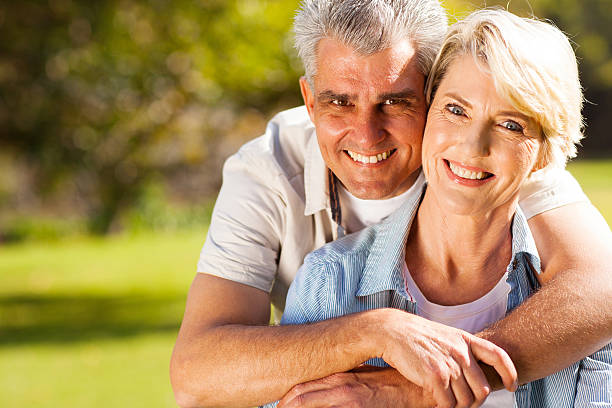 istock senior man hugging wife 469721589