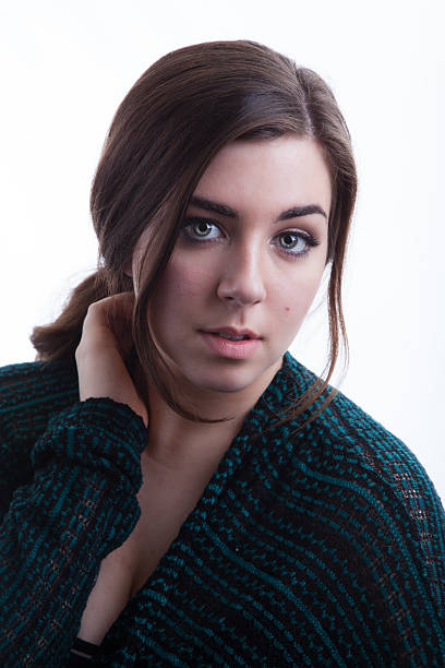 Portrait of Fashion Model Wearing Fall Green Sweater on White stock photo